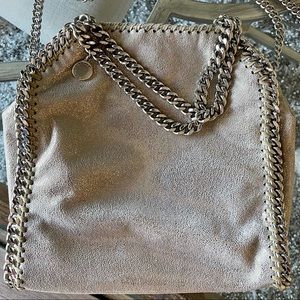 Silver Metallic Stella Mini
Cross body or hand held